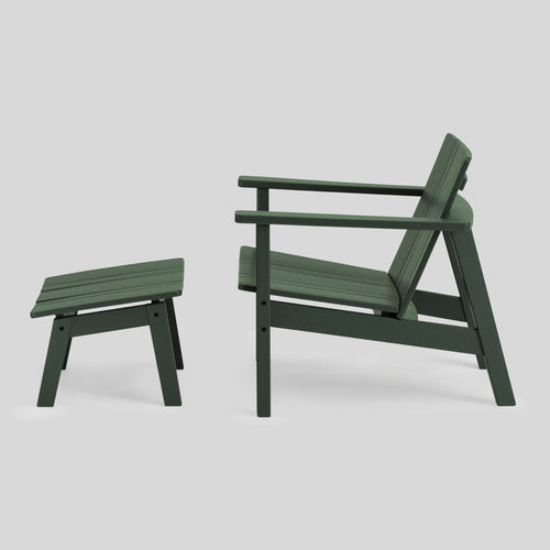A studio photo of Low Chair Green / Chair + Ottoman