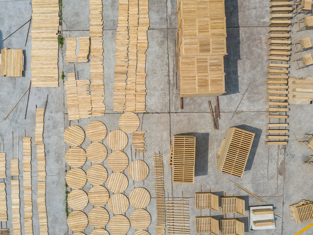 Teak wood products on display at a factory