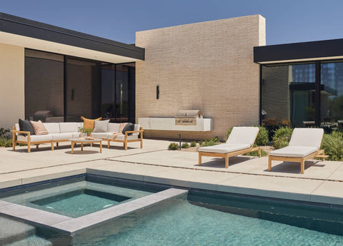 outdoor furniture near pool in luxurious backyard setting